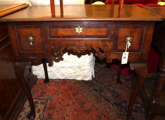 A mid 18th century-style oak lowboy, Width 83cm